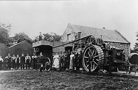 Steam tractor driving a threshing mill, c.1910
